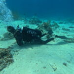 PADI Advanced Open Water 7 Underwater photo of diver practicing buoyancy in Bali